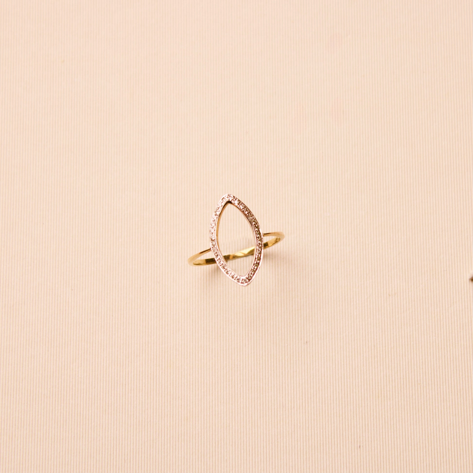 14k yellow gold geometric ring featuring small diamonds