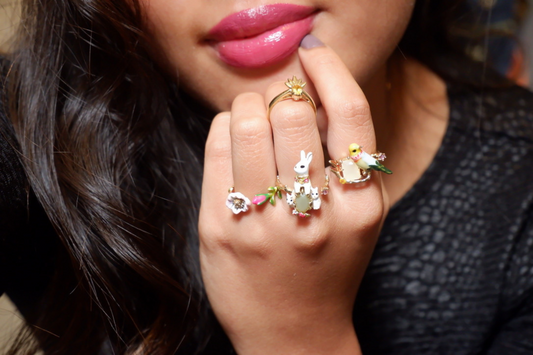 Girl wearing multiple costume jewelry ring