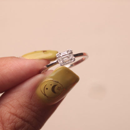 14-karat white gold ring featuring a small illusion cut diamond
