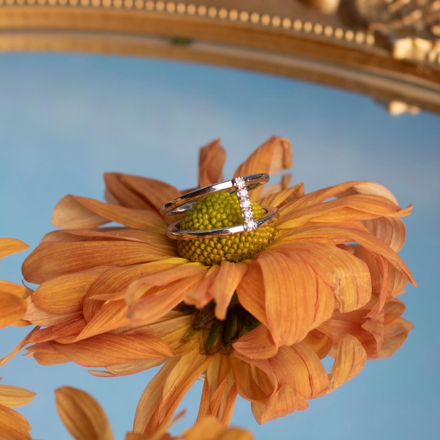 Melissa Symmetrical White Gold Ring on a Flower